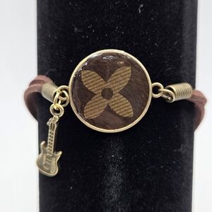 Upcycled Louis Vuitton Bracelet With Guitar Charm In The Color Gold